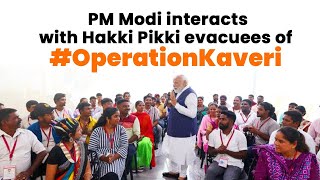 PM Modi interacts with Hakki Pikki tribe members evacuated under #OperationKaveri, in Karnataka