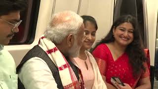 Prime Minister Narendra Modi interacts with people in Delhi Metro l PMO