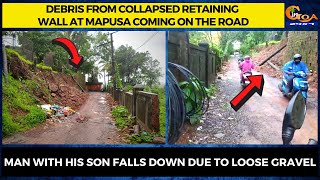 Debris from collapsed retaining wall at Mapusa coming on the road.