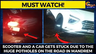 #MustWatch! Scooter and a car gets stuck due to the huge potholes on the road in Mandrem.