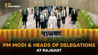 PM Modi & Heads of Delegations at Rajghat to pay homage to Mahatma Gandhi