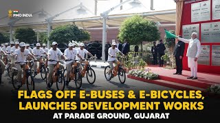 PM Modi flags off e-buses & e-bicycles, launches development works at Parade Ground, Gujarat