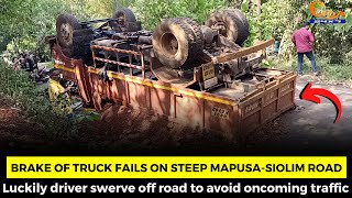 Brake of truck fails on steep Mapusa-Siolim road.