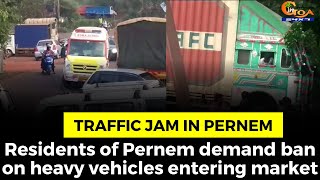 Heavy vehicles create traffic jam in Pernem market.