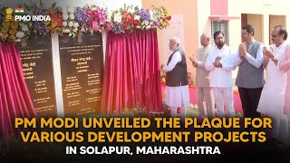 PM Modi unveils the plaque for various development projects in Solapur, Maharashtra