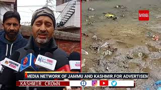 Locals of Bazar Mohalla Ompora Budgam Demand The Authorities To Clean The Irrigation CanalExn