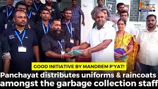 Mandrem P'yat distributes uniforms & raincoats amongst the garbage collection staff