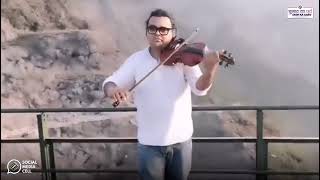 In the twilight's glow at the Chenab Rail Bridge, a violinist's bow