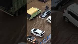 A girl had to climb through rear hatch of the car due to flooded road at Patto-Panaji today morning