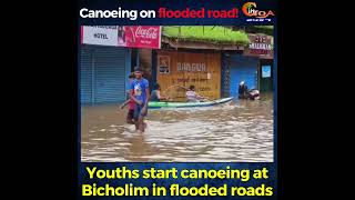 Youths start canoeing at Bicholim in flooded roads