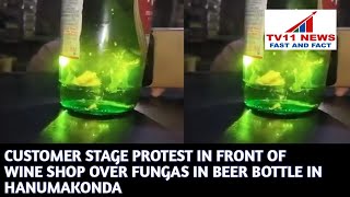 CUSTOMER STAGE PROTEST IN FRONT OF WINE SHOP OVER FUNGAS IN BEER BOTTLE IN HANUMAKONDA