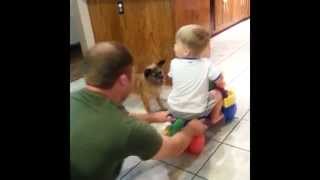 Dad Pushes Boy on Bike Dog Pulls Him Back