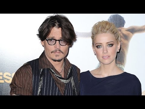 Amber Heard Sparks Engagement Rumors by Hiding Her Hand