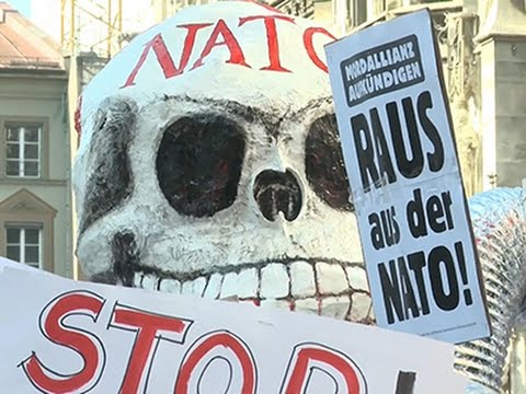 Raw- Anti-NATO Protesters March in Munich News Video