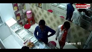 Fearless goons beat up the shopkeeper and injure him with a knife